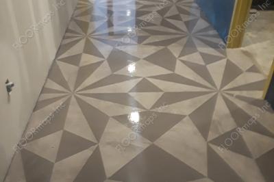 Pearl grey microtopping has been applied overtop our 3.4 mil low tack vinyl stencils. Once dry all excess has been removed to reveal the alternating grey colors of this geometric pattern.