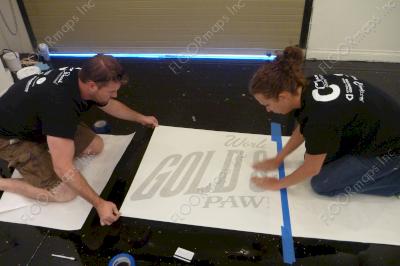 First layer of the Gold and Silver Pawn Shop logo being applied with our 3.4 mil vinyl stencils.
