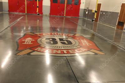 View of the firetruck bays with the Lathrop Manteca Fire Station No. 35, 15 footer logo centered in between down a major joint line.