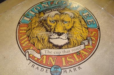 Hawaii's Lion Coffee Logo installed using Ameripolish Classic turquoise, gold, red, green, and black concrete dyes on a previously sand colored polished concrete floor.