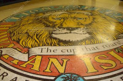 Close up of complete Lion Coffee logo installed with Ameripolish Classic concrete dye colors.
