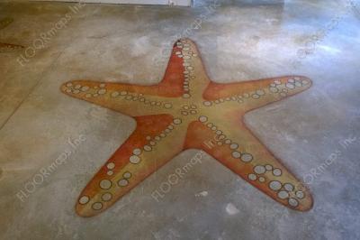 Orange starfish amid blue ocean installed on a Polished Concrete Floor using dye and 3.4 mil vinyl finished with sealer.