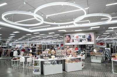 Custom Eye shape with 4 inch curved strip and Tribeca petal pattern installed in the beauty section of a Target store.
