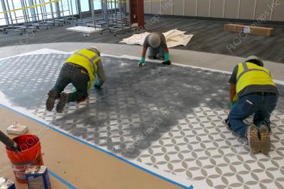 Installation of black dye being applied overtop exposed areas of our 3.4 vinyl stencils.