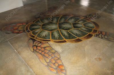 Full image of installed turtle surrounded by sand on a polished concrete floor using dye and 3.4 mil vinyl finished with sealer