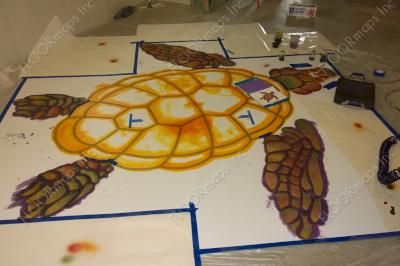 Installation of Aussie sea turtle on a polished concrete Floor using dye and 3.4 mil vinyl finished with sealer.