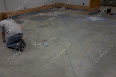 Quarter inch pin stripping tape installed to create a tile pattern over the floor.