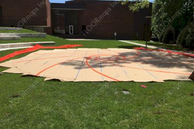 11 panel pounce template taped together and marked with orange spray paint.