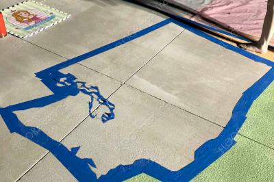 Mid installation of the USA map design installed with colored cementitious epoxy.
