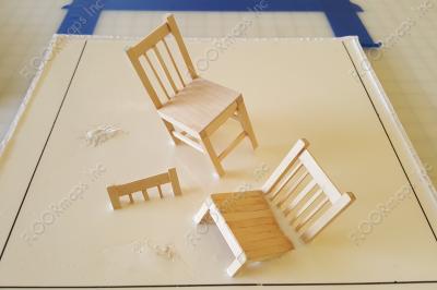 Small scale version of anamorphic forced perspective 3D chairs.