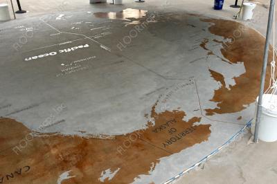 Top overview of Pacific War World Map years 1941-1945 installed using 30 mil Blast Resist vinyl stencil on previously colored brown cementitious overlay, sand blasted and colored with black concrete stain.