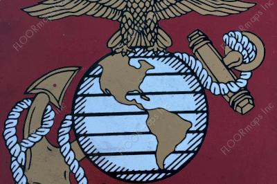 Close up of US Marine Corp Seal on black microtopping circle and gold, red, and white spray paint installed with 3.4 mil vinyl stencil and Deco Guard sealer