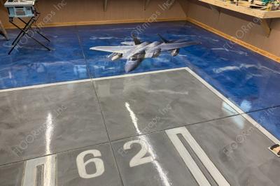 F15 Strike Eagle 80/20 Perforated Print installed on blue metallic coated floor sealed with polyaspartic Clear Coat.