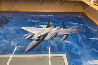 F15 Strike Eagle 80/20 Perforated Print installed on blue metallic coated floor sealed with polyaspartic Clear Coat.